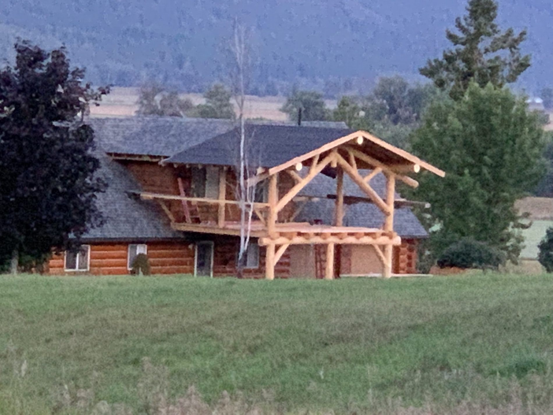 Entry structure on an existing log home
